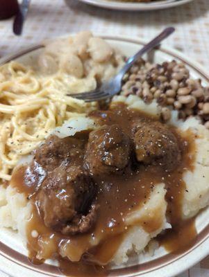 Meatballs and gravy over mashed potatoes. So good!