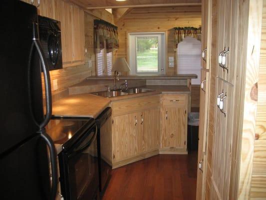 Kitchen is fully stocked. Full sized oven-stove, and fridge.