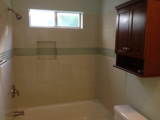 new tub and new tiled shower surround