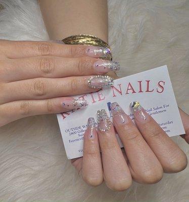 Beautifully feminine blinged nails done by our new technicians!