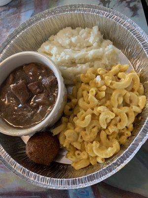 Beef tips, Mac & cheese, mashed potatoes & a hush puppy