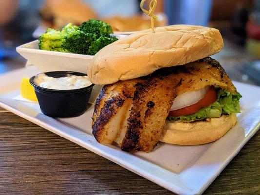 Grouper Sandwich. Blackened and served on a toasted roll with a side of housemade tartar. Includes a side; I got broccoli. Market.