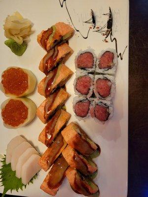 White tuna sashimi, Ikura (salmon roe) sashimi, pink Lady roll, and Toro (fatty tuna) roll....delicious!