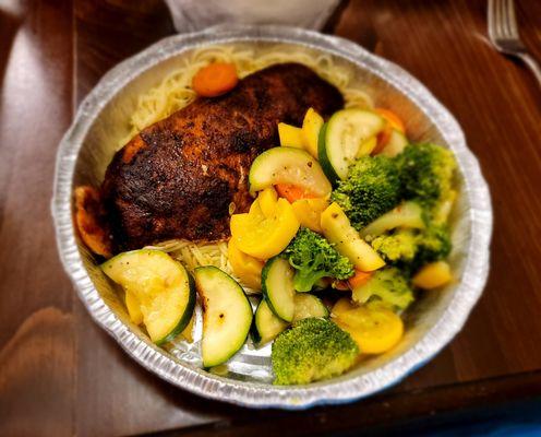 Blackened Snapper with Florentine sauce and vegetables on a bed of angel hair pasta...