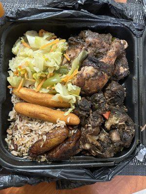 Jerk Chicken and oxtail with festival, plantain, cabbage, and rice and peas