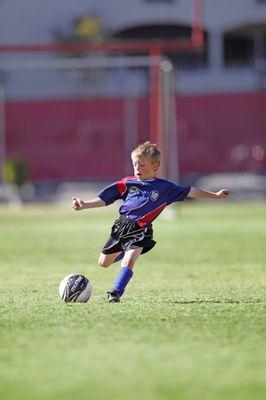 Learning the fundamentals of soccer with trained coaches at AYSO region 418 Chicago Lakefront