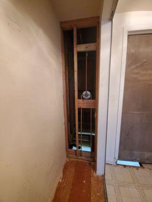 Side of the master bedroom closet. You can see that the floor in the bathroom is gone.