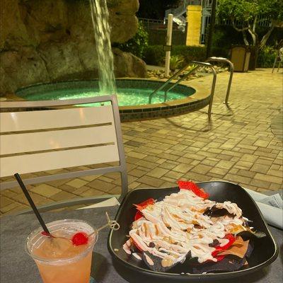 Rum punch, nachos with sour cream & a waterfall hot tub