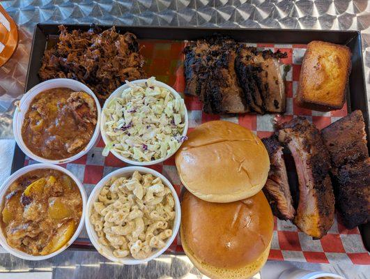 Peach cobbler, coleslaw, Mac n cheese, brisket, pulled pork corn bread. All delicious!