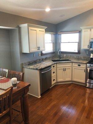 Beautiful feather white shaker style kitchen with crown