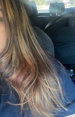 patchy, brassy, untoned with red hues. supposed to be a balayage.