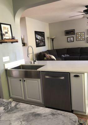 Quartz countertops and stainless farm sink