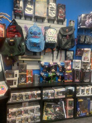 Some of their backpacks and Funkos