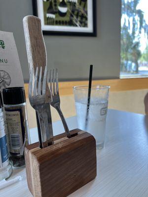 Communal cutlery... your knife and fork are just hanging out in the open air, stuck into this unwashed block of wood