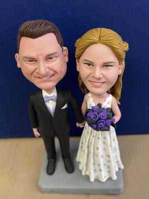 This is my wife's and my cake topper bobble heads. That is the suit I bought at Men's Wearhouse.