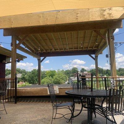 Outdoor, covered patio with a stage.