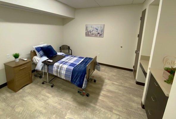 Green Valley Health and Wellness Suites resident room. All rooms come with nightstand, chair, closet, drawers, television, and phone.