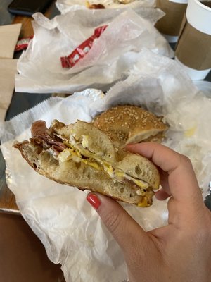 Homemade sesame bagel with fresh fried egg, cheddar, and ham!