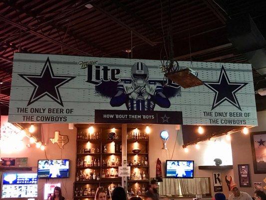 Dallas Cowboy banner on top of Bar...