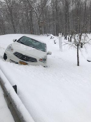 My car slid off the road went over guard rail