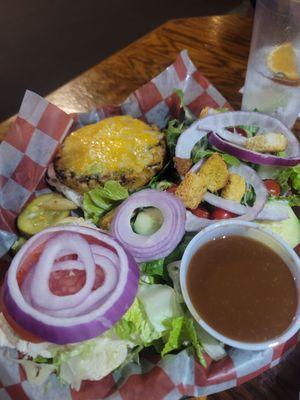 Veggie burger with a side salad