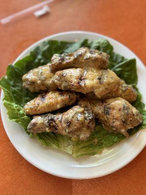 Grilled bone in chicken wings with garlic parmesan