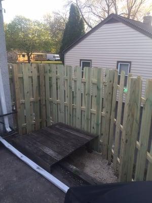 Backyard privacy fence above the retaining wall