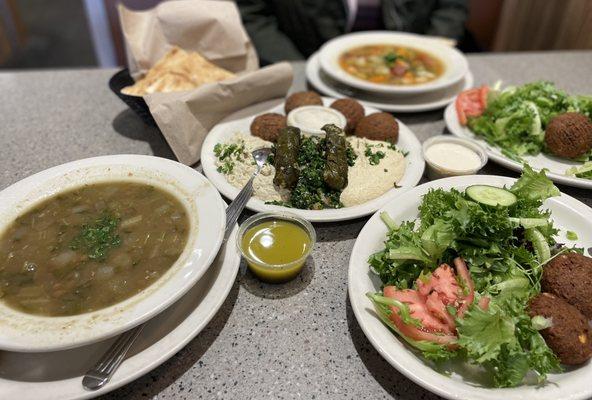 Lentil Soup, Veggie Combo, Pita Wedges, V-Nine Soup, Falafel Salad (divided onto 2 plates), Aladdin dressing, & Lemon/Tahini dressing