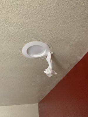 Another light fixture with a paper towel/napkin to keep the fixture secure