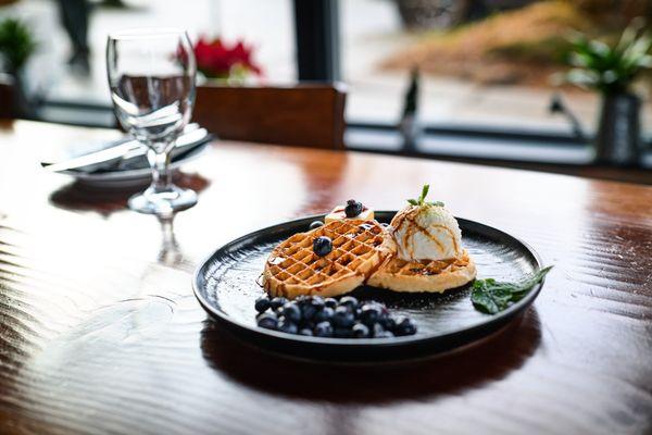 House made waffles, with icecream and fresh blueberries.