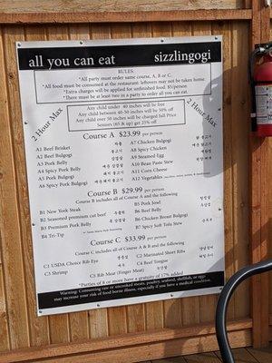 Large menus are posted on the patio walls, excellent idea