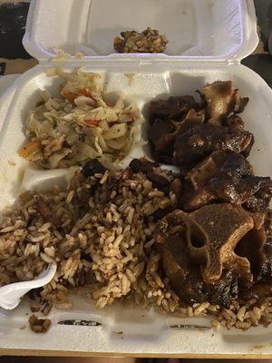 Small oxtail meal. At the top of the tray is rotten mushed plantain.