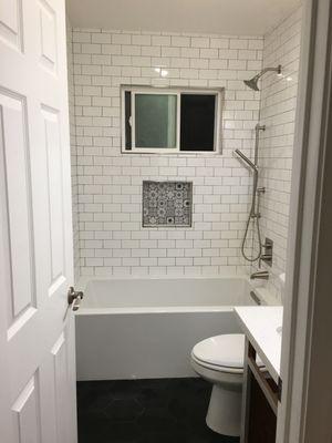 Beautiful subway tile with brush, nickel finishes