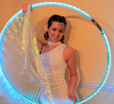 I can perform with LED (glowing) hula hoops for a fun glow party. I can even bring glowing hoops for your guests to borrow.