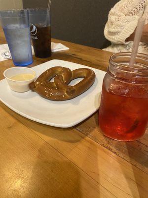 Beer cheese and pretzel with distillery cosmo