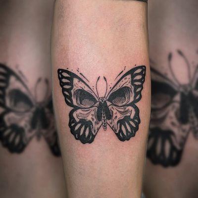 Butterfly tattoo on forearm