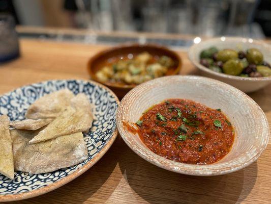 Matbucha - roasted bell peppers, onion sofrito, paprika, and melted tomatoes.  Served with homemade pita bread.