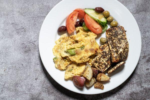 Kibris (Cyprus) - Cypriot style asparagus and egg scramble, grilled mint-rubbed halloumi cheese, cucumber, tomato, and kalamata olives.