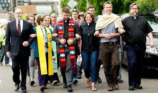 Previous Havurah rabbi, Rabbi Joey, and current rabbi, Rabbi Benjamin march down the street towards the ICE facility to protest.