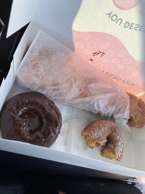 Pumpkin spice donut and a chocolate cake donut