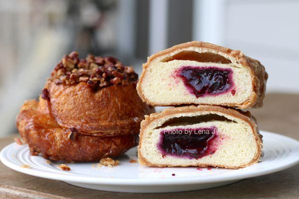 Inside of Peanut Butter & Jelly Donut ($3.97), Pecan Sticky Bun ($3.61) in back