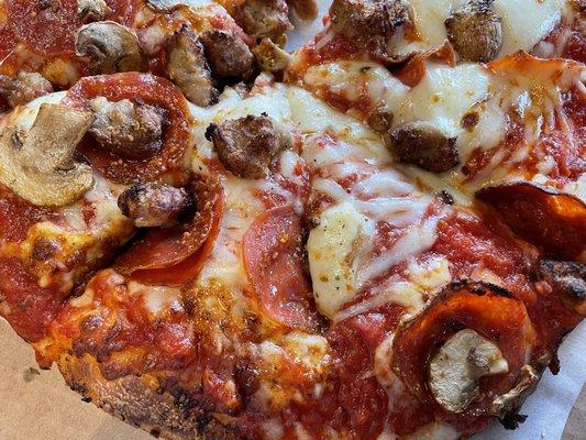 Thick crust, mozzarella Parmesan, fresh mozzarella, pepperoni, mushrooms, sausage