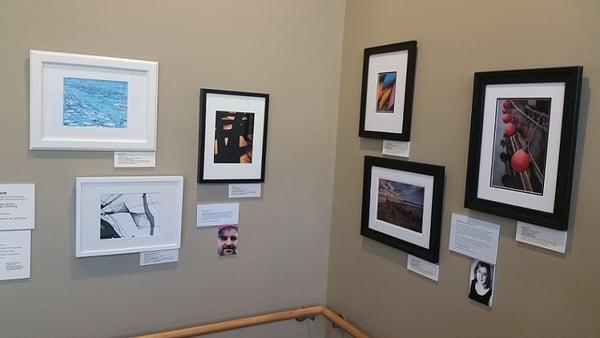 Shoot to Show student photography display in the main stairwell.