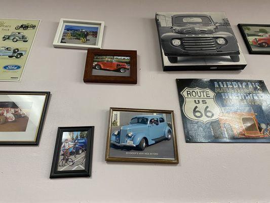 Local and personal car images and paintings on the walls.