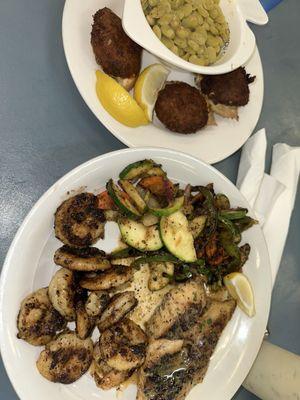 Grilled snapper, grilled shrimp, stuffed crab with two vegetables as sides