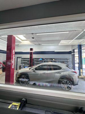 Waiting area with window looking into working station