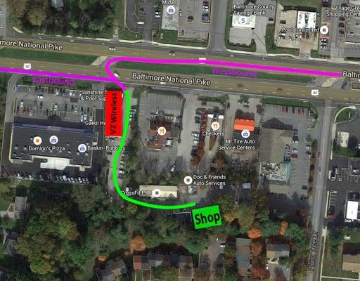 The shop shares its parking lot with a gray cell tower, look for that and the Verizon Wireless store when you're on 40.