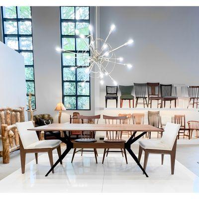 Amish Jefferson Contemporary Trestle Dining Table and Upholstered Side Chair. Shown in Walnut wood with Natural finish.