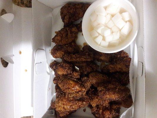 About 17pc of honey soy garlic fried wings. Pickled radishes in a small cup. (complimentary)