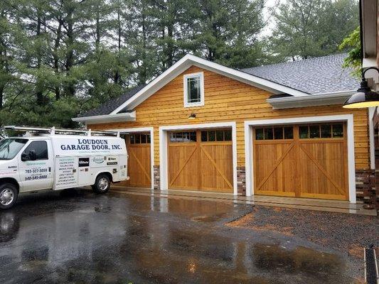 Outside of CHI carriage door model 5700 series in cedar with Madison windows.